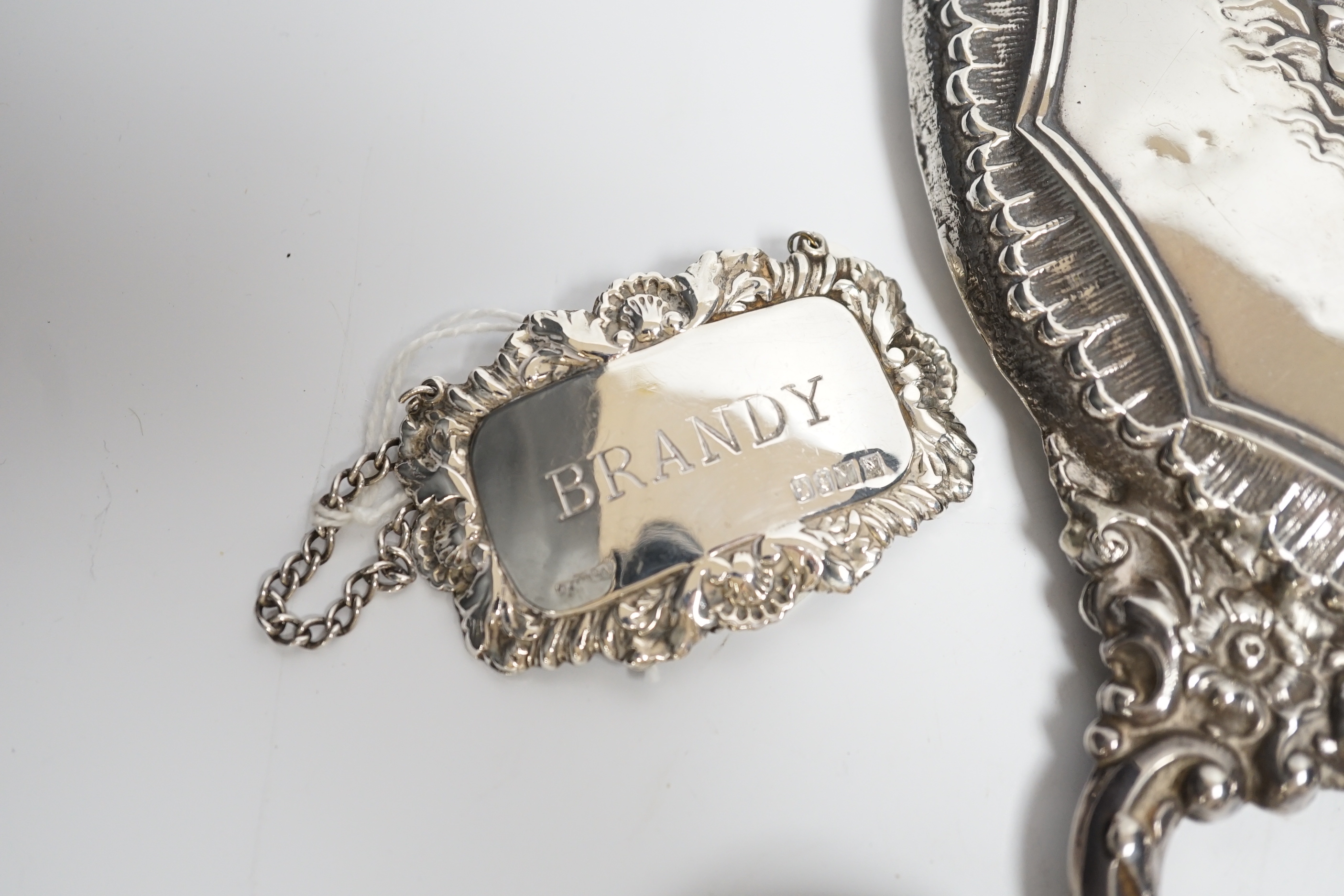 Sundry small silver including a cased set of six late Victorian silver buttons, Birmingham, 1900, a George V silver rattle bell, a silver hand mirror, wine label, scent bottle, etc.